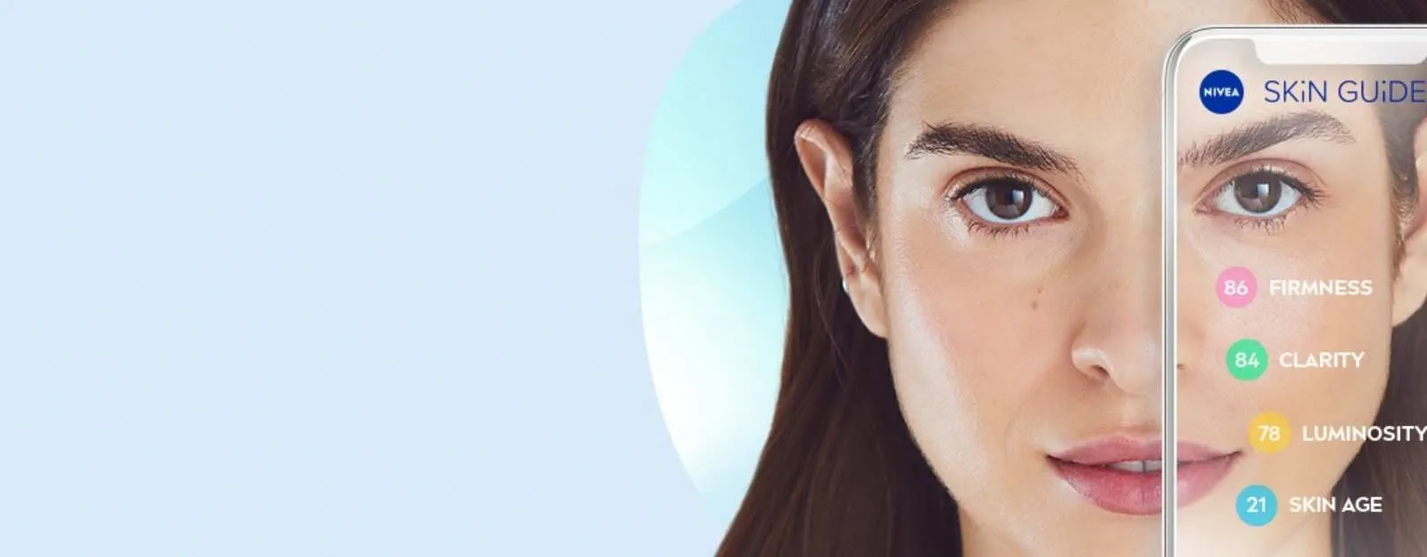 Smartphone displaying NIVEA’s SKiN GUiDE AI app analyzing a woman’s face for skin clarity, firmness, and luminosity using facial scoring technology.
